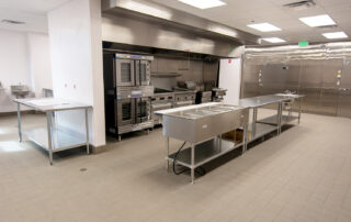 Kitchen area with sinks and stainless kitchen equipment